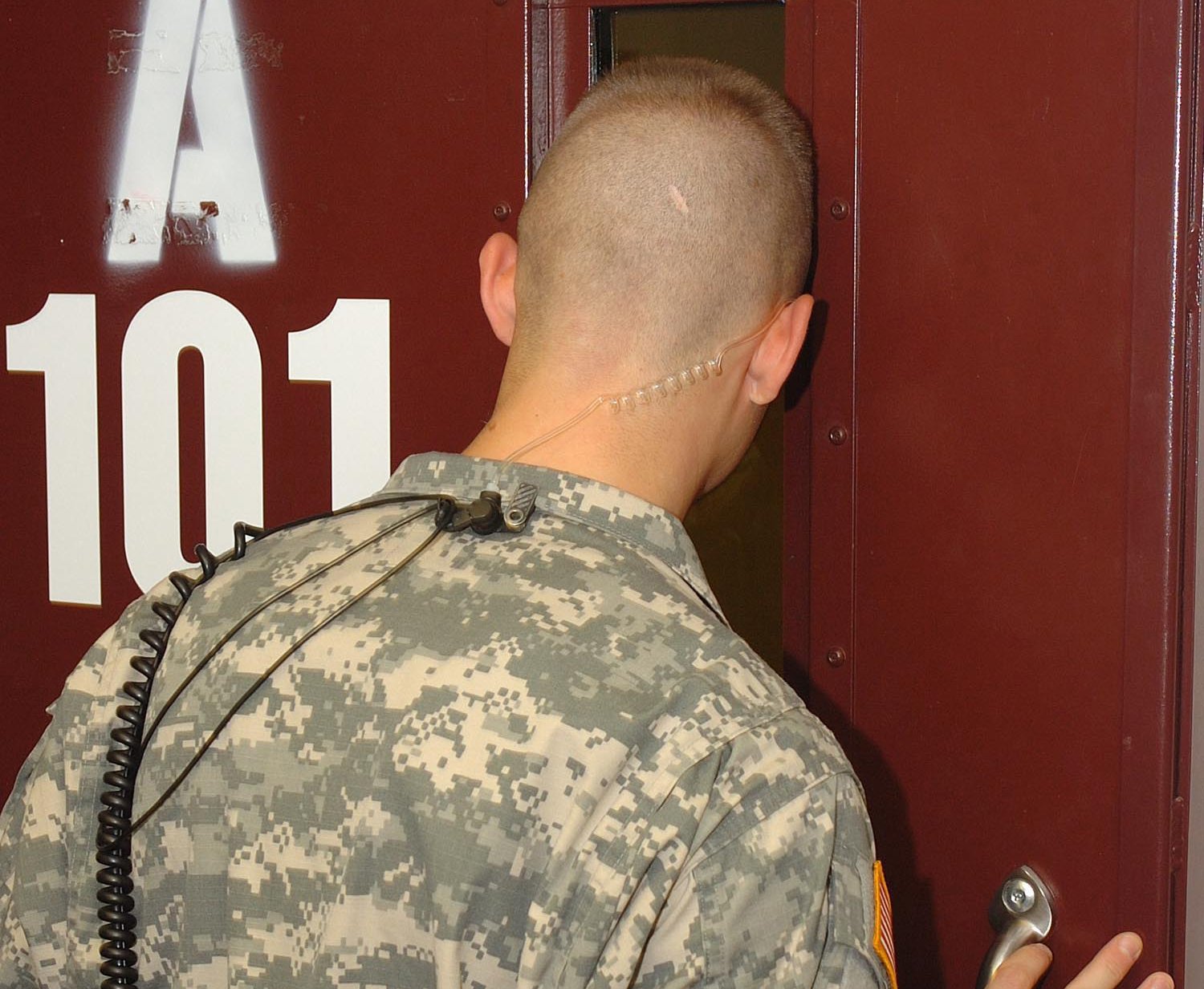 Member of the Army Guard Force checks on a detainee in Camp 5, Guantanamo