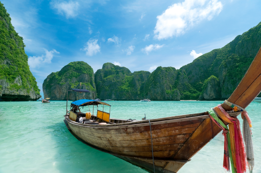 A boat in the crystal waters in Phuket, Thailand