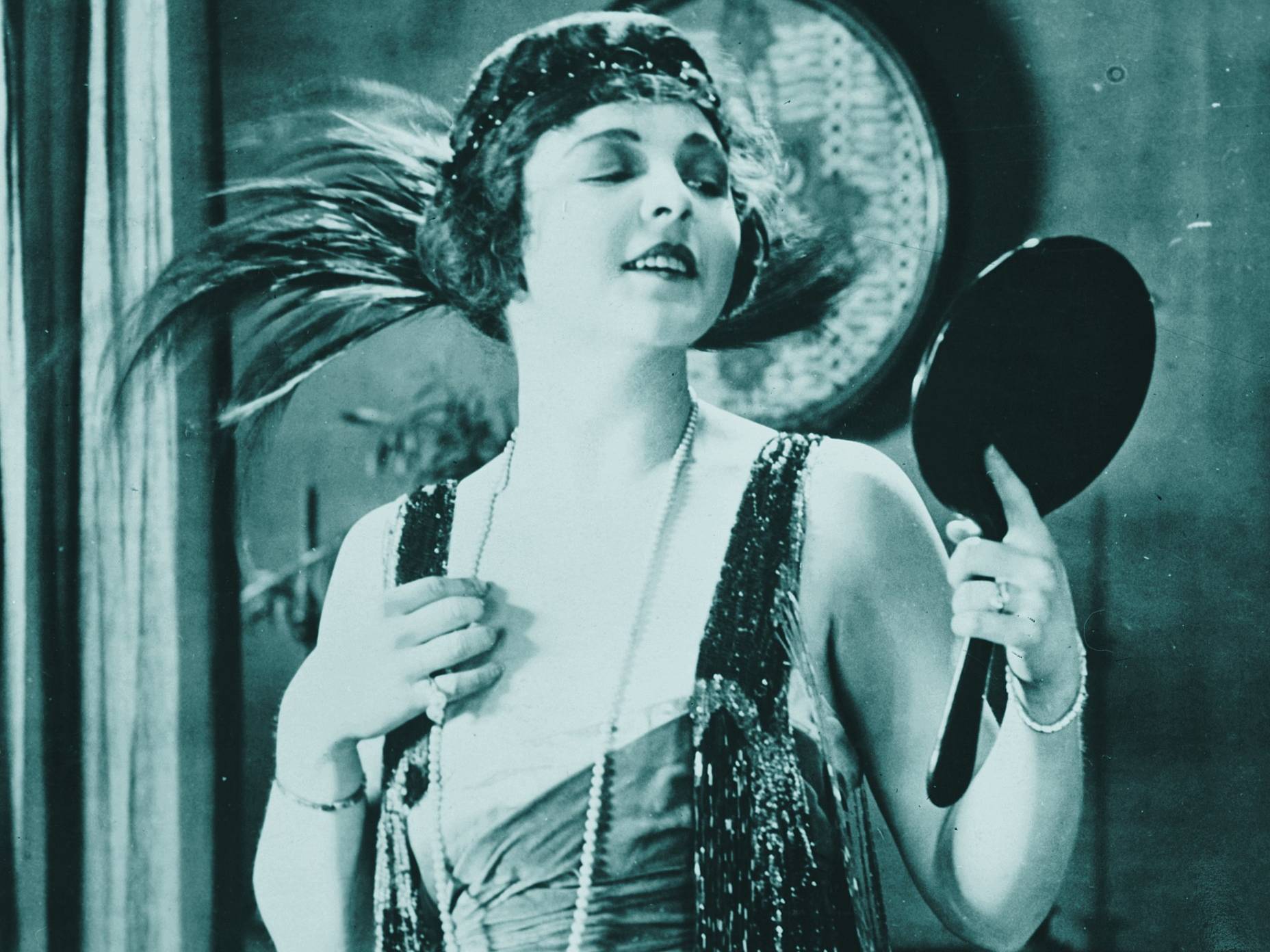 Lucy Cotton, standing up in a dress.