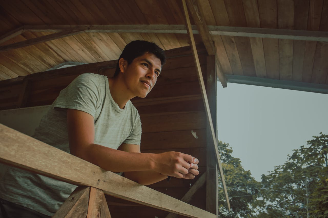 Man Standing Inside Wooden Room