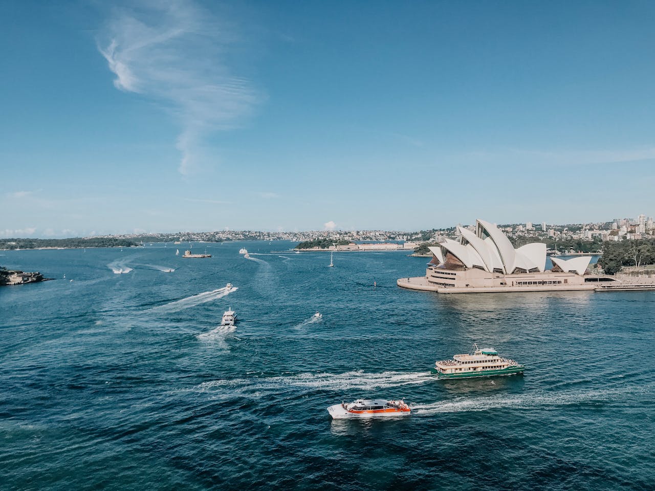 Sydney Opera House with boats in the ocean around