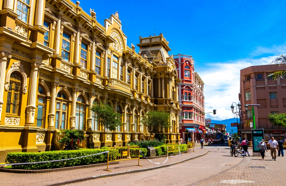 Colorful street with cars stores in San José, Costa Rica