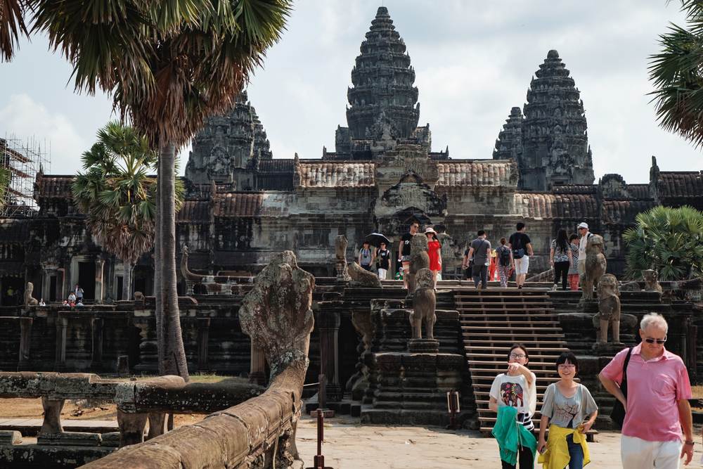 Unidentified tourists visit to Angkor Wat temple