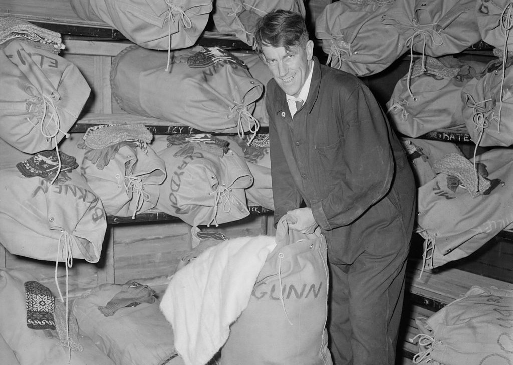 Edmund Hillary packs sack - 1957