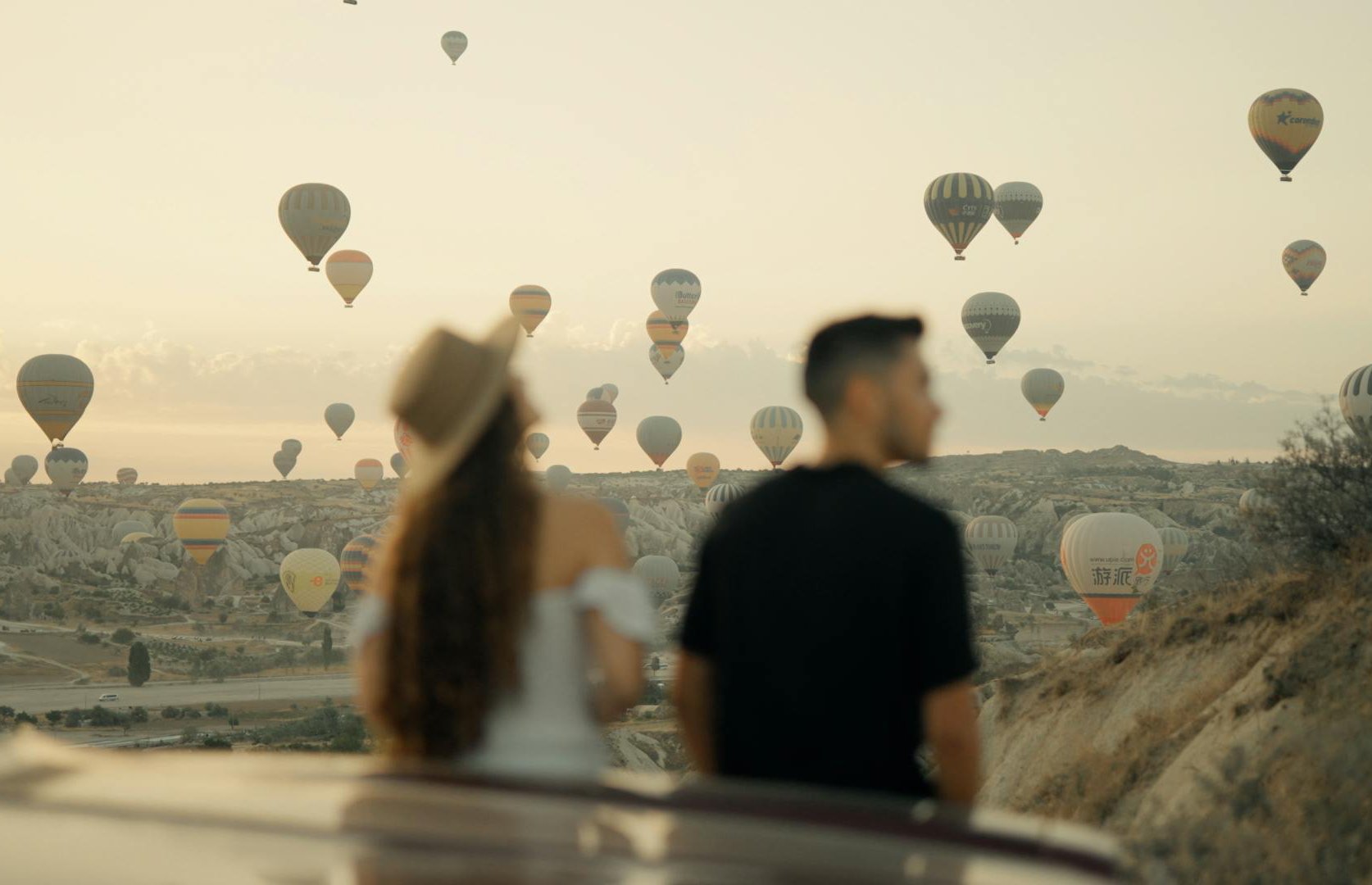 Couple watching hot air balloons in Turkey