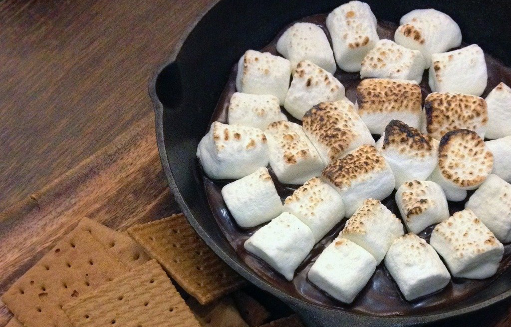 A skillet filled with marshmallows and grahams