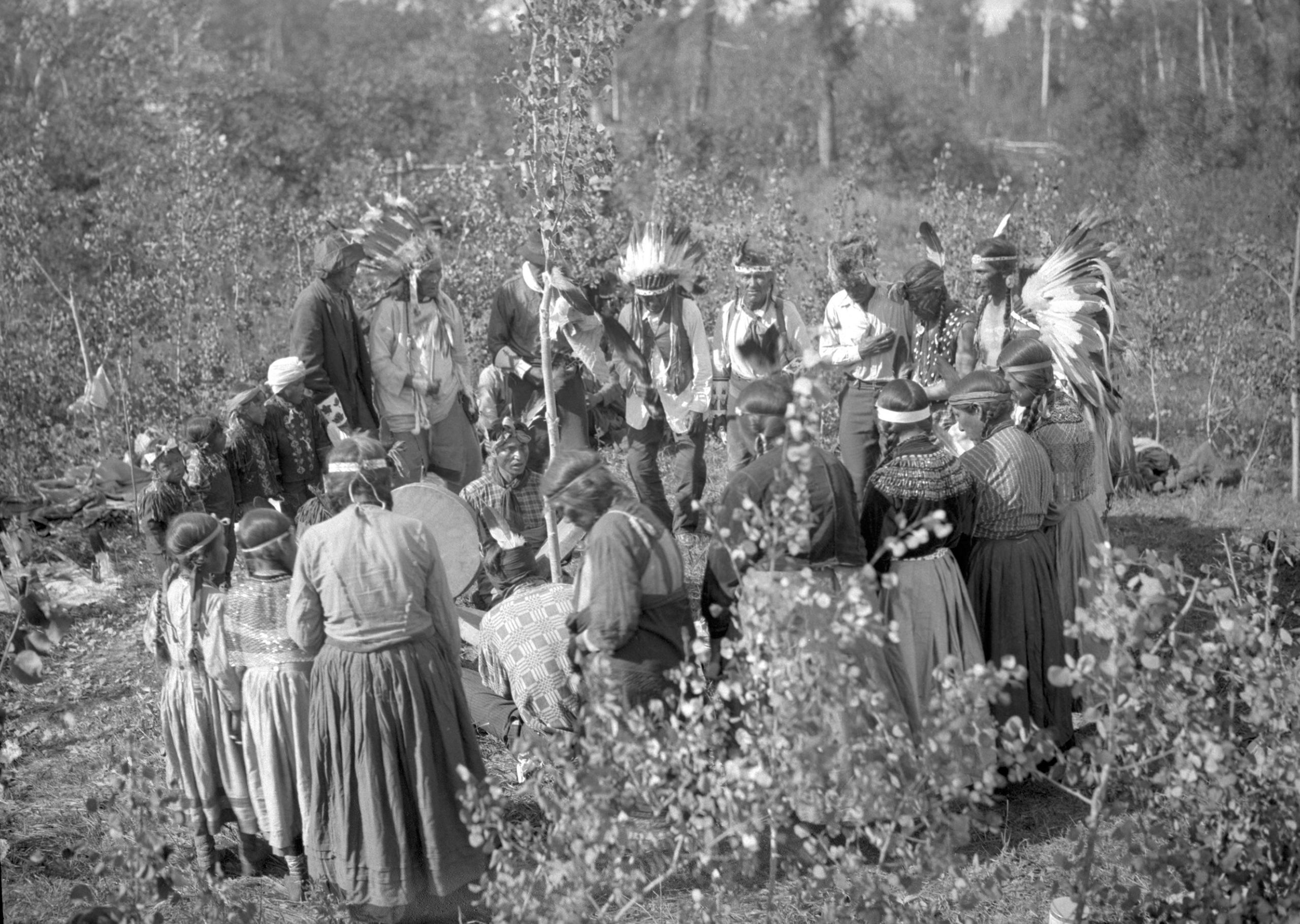 Cree Men, Women And Children Participating In A Ceremony