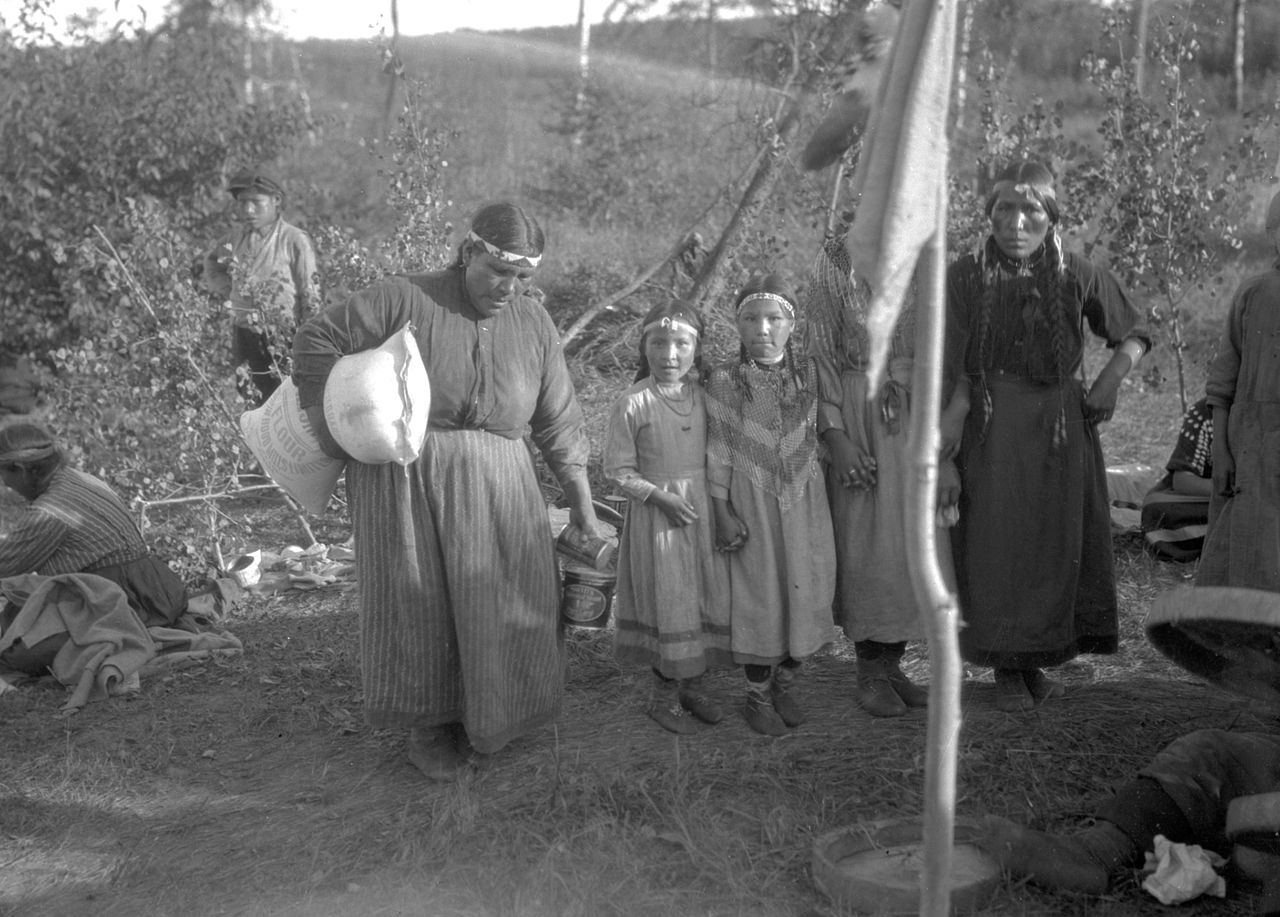 Cree Woman Carrying Domestic Supplies