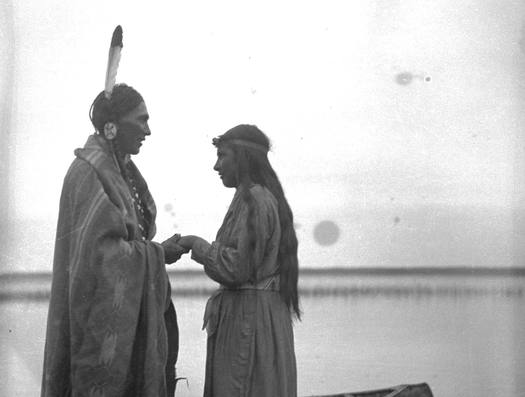 Young Cree Couple Beside A Lake