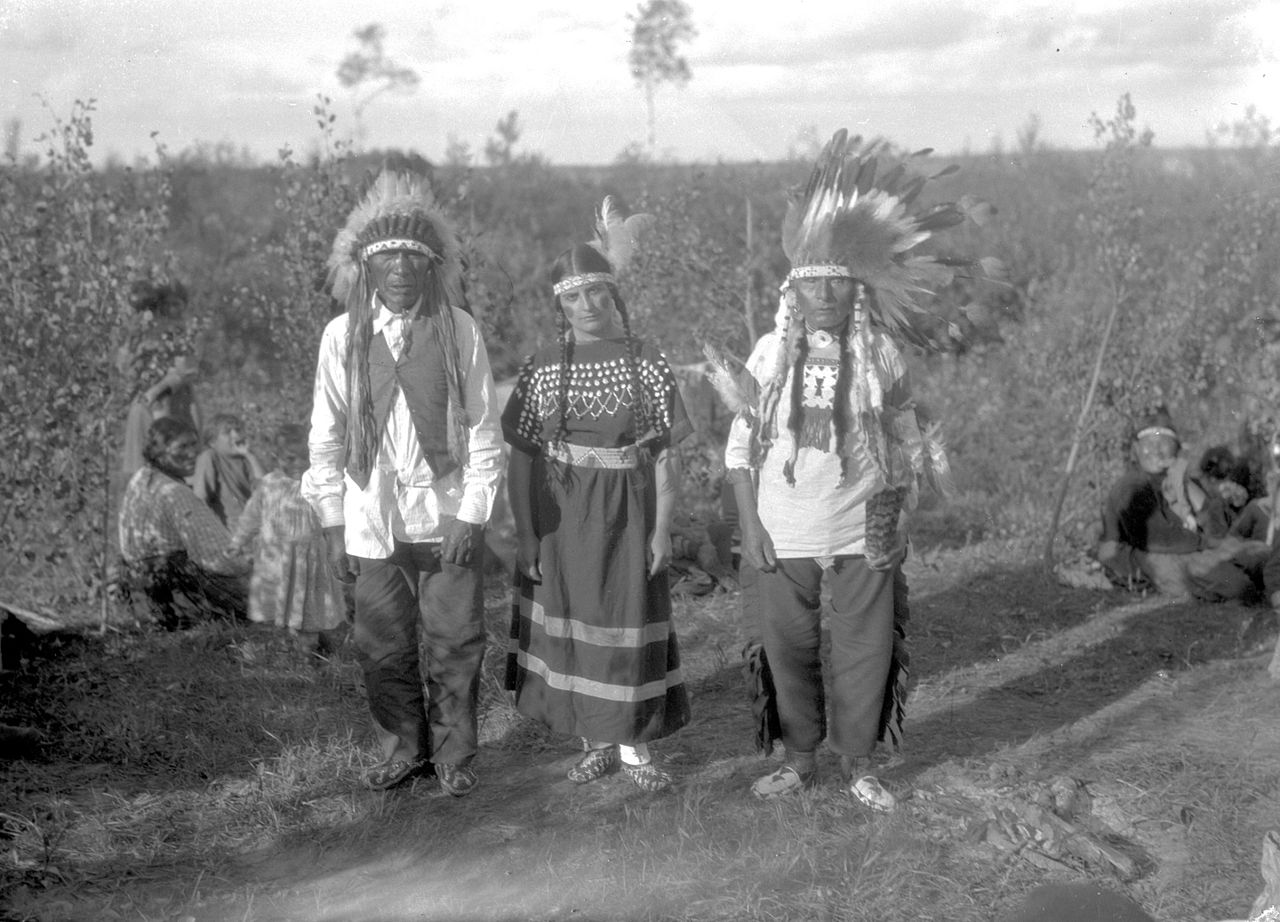 Young Cree Woman Between Two Elders