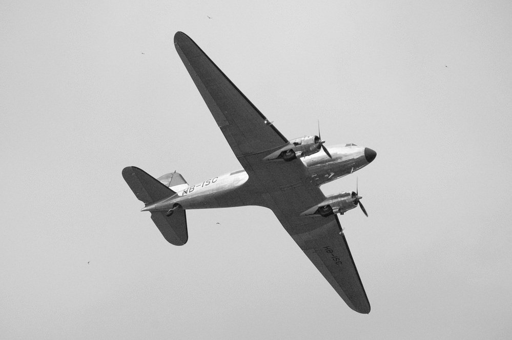 Grayscale Close Up Photo of Douglas DC-3 aircraft in flight