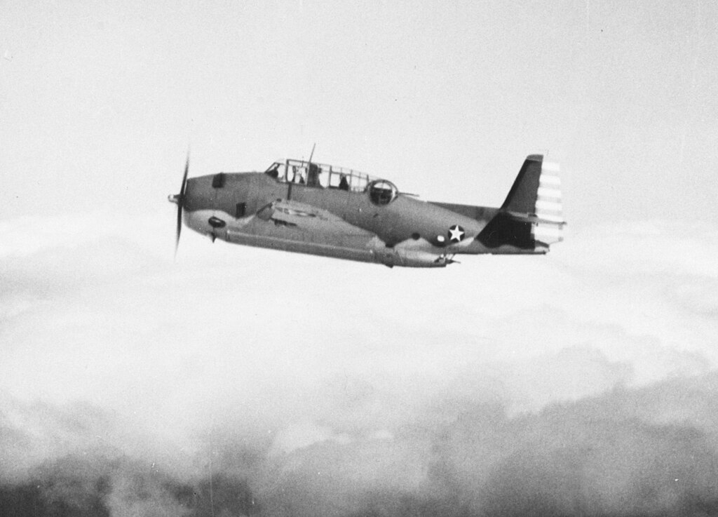 Grayscale Photo of Grumman TBF Avenger aircraft in flight