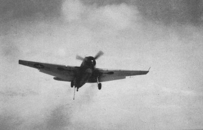 Navy Grumman TBF Avenger approaching the escort carrier USS Takanis Bay