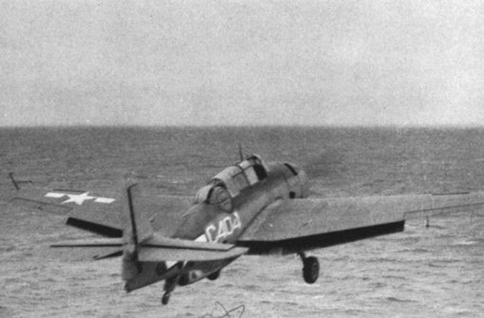 Grayscale Photo of Grumman TBF Avenger aircraft in flight