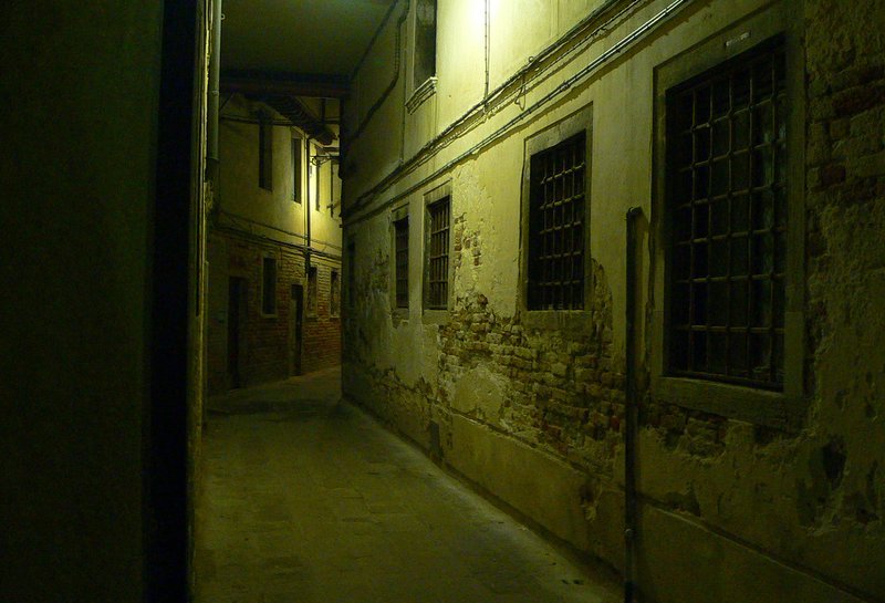 Narrow Alleyway at Night in Venice, Italy