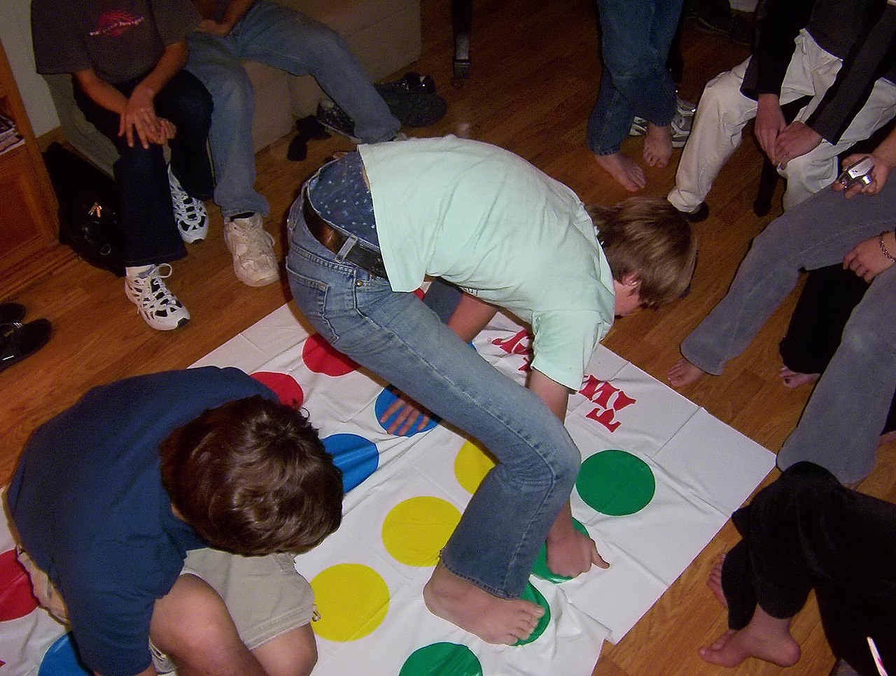 Kids playing Twister game.