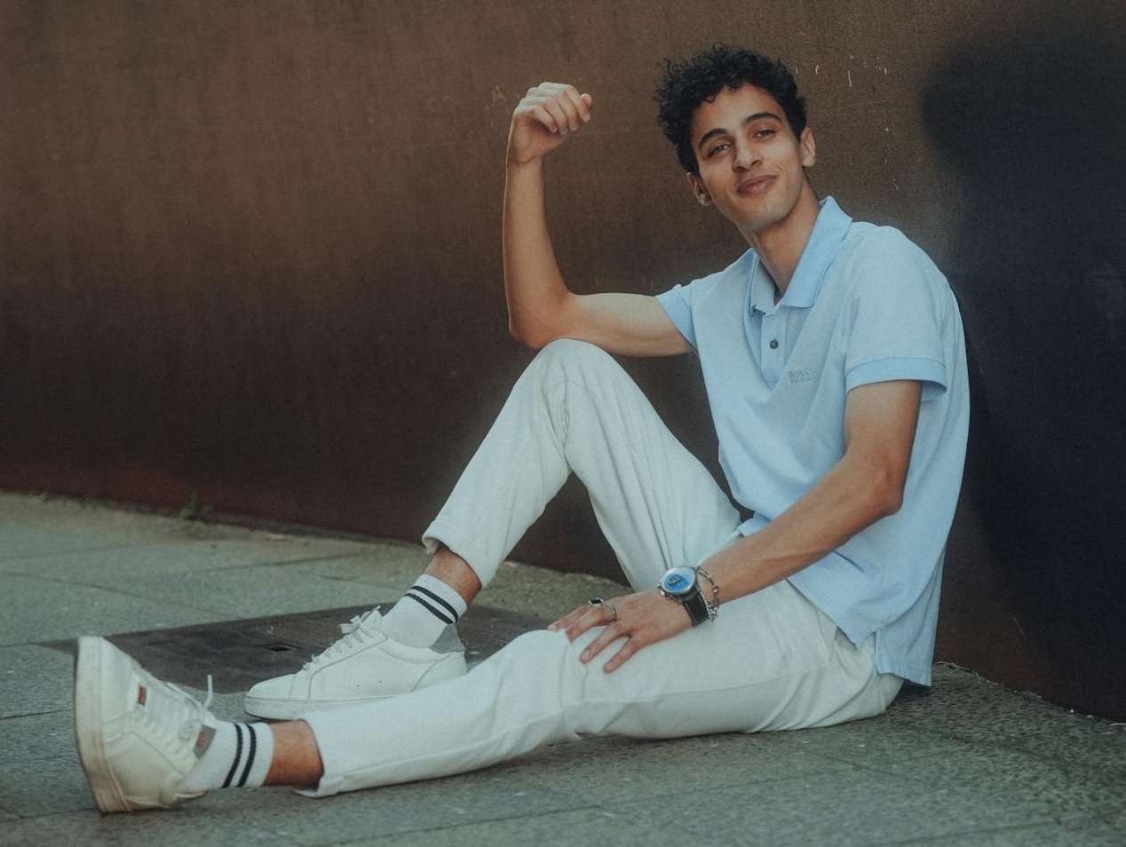 Man in a Blue Polo Shirt and White Pants