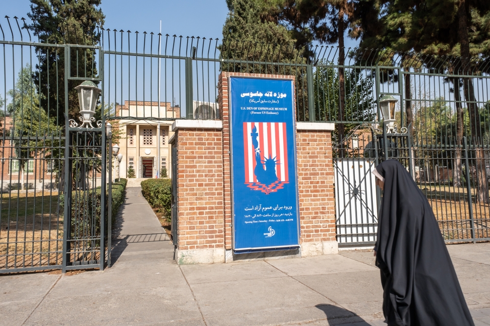 Woman near entrance to the former US Embassy in Tehran