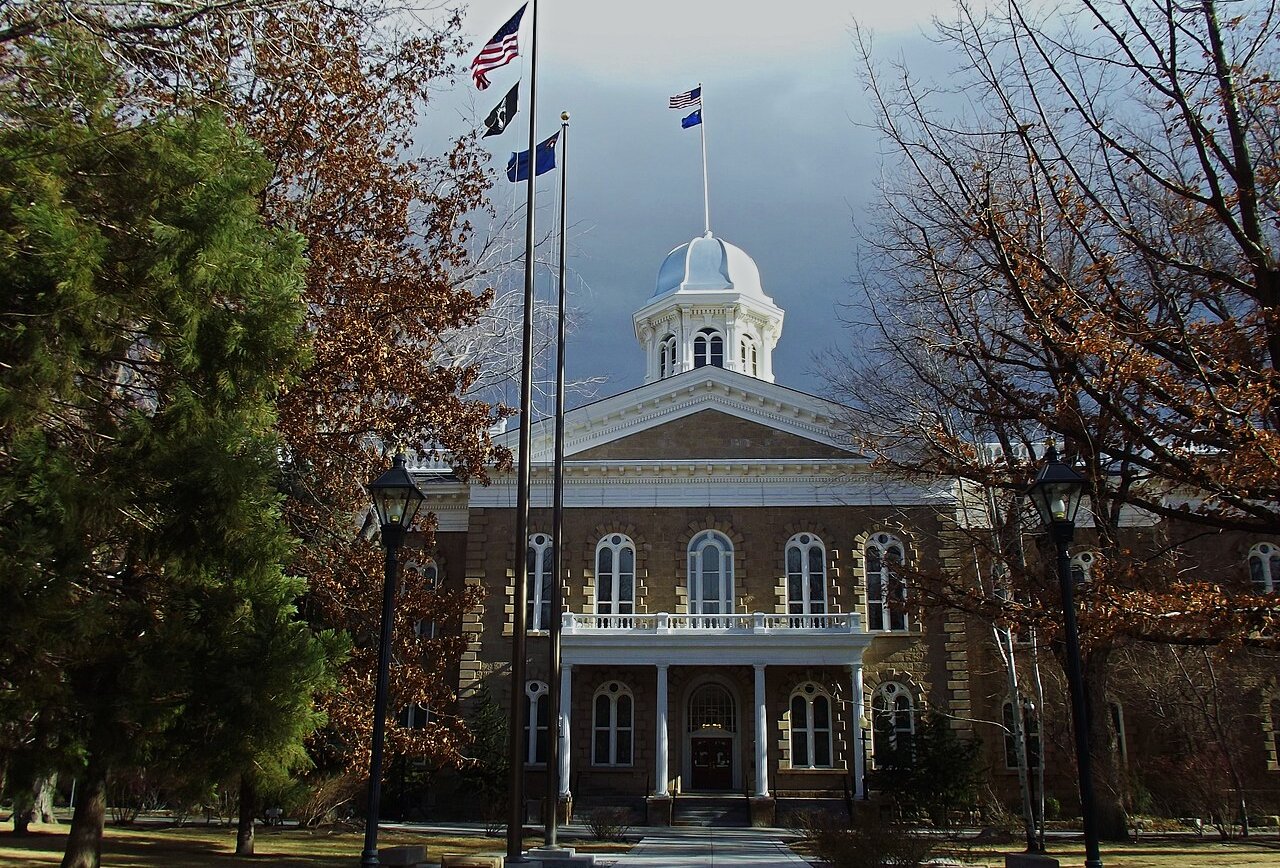 Nevada State Capitol with flags waving at the top