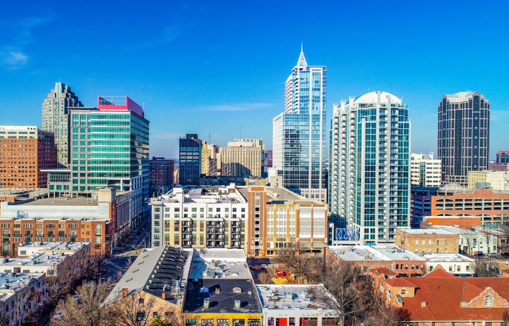 The image showcases a Vibrant urban scene of Raleigh, North Carolina