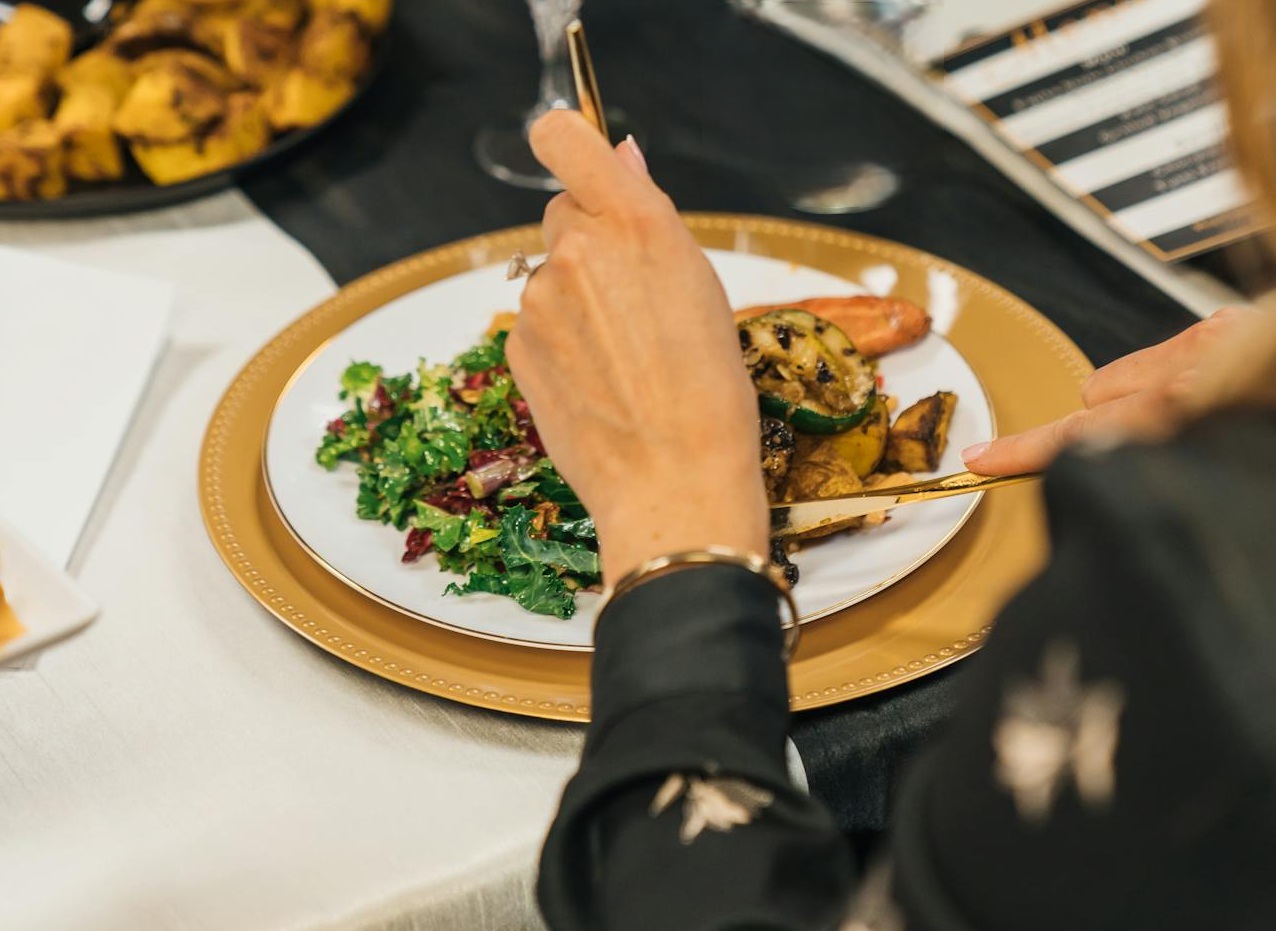 Woman Eating Meal in Restaurant
