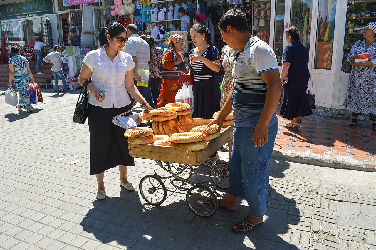 Bread seller and buyer in Tashkent - 2015