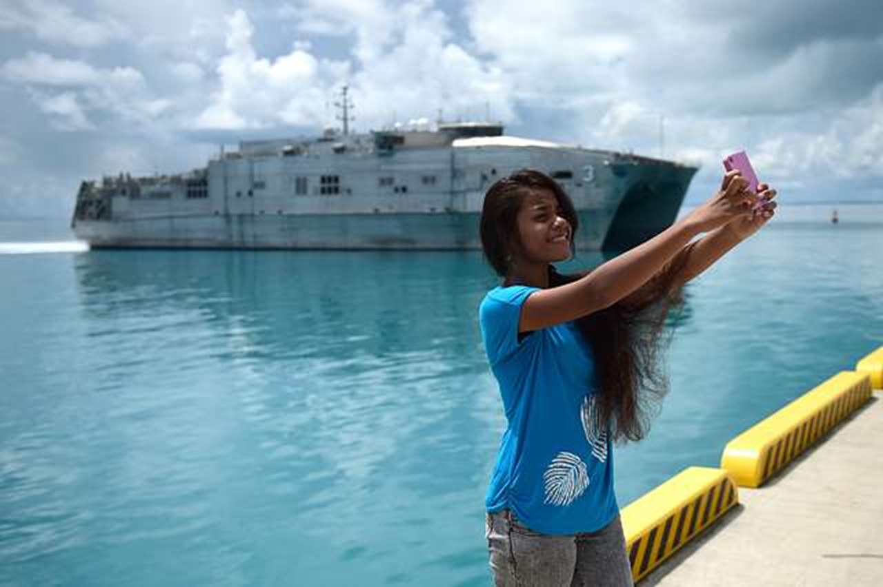 An I-Kiribati girl pose for a “selfie” in Tarawa, Republic of Kiribati - 2015