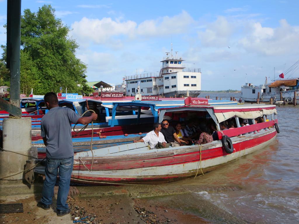 Small ferries take passengers across the Suriname River - 2014 Suriname