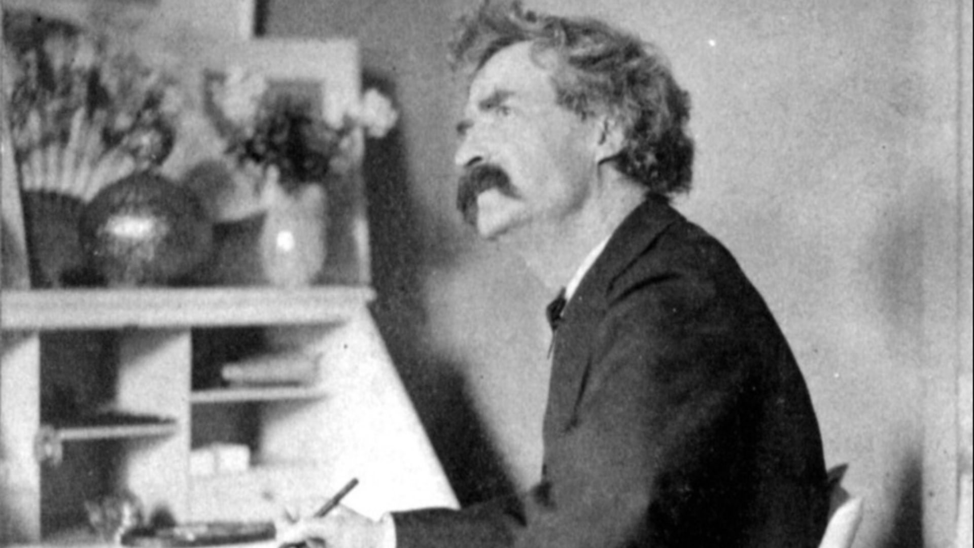 File:Mark Twain pondering at desk.jpg