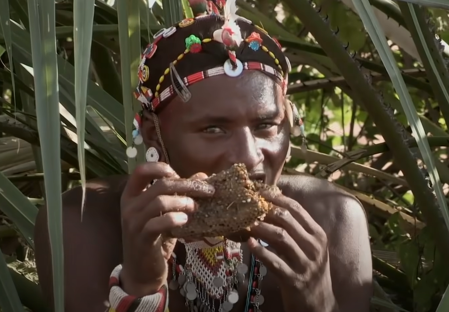 Samburu tribe man eating
