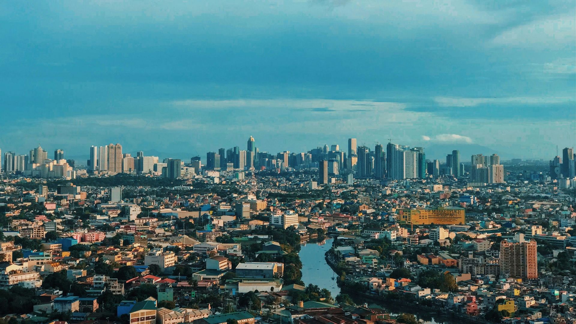 city skyline under blue sky during daytime