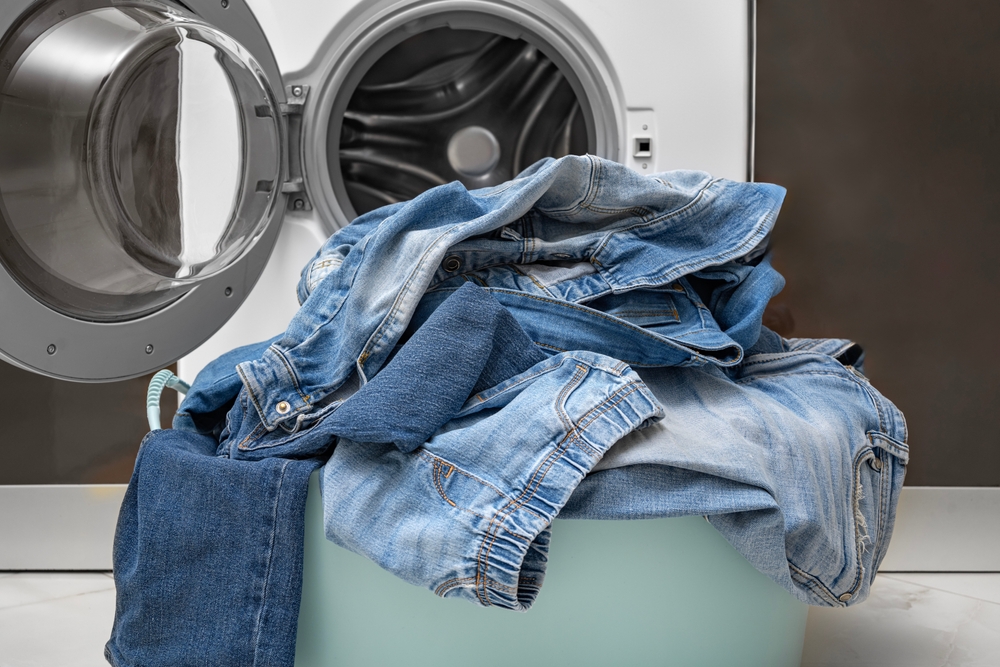 Jeans in front of washing machine