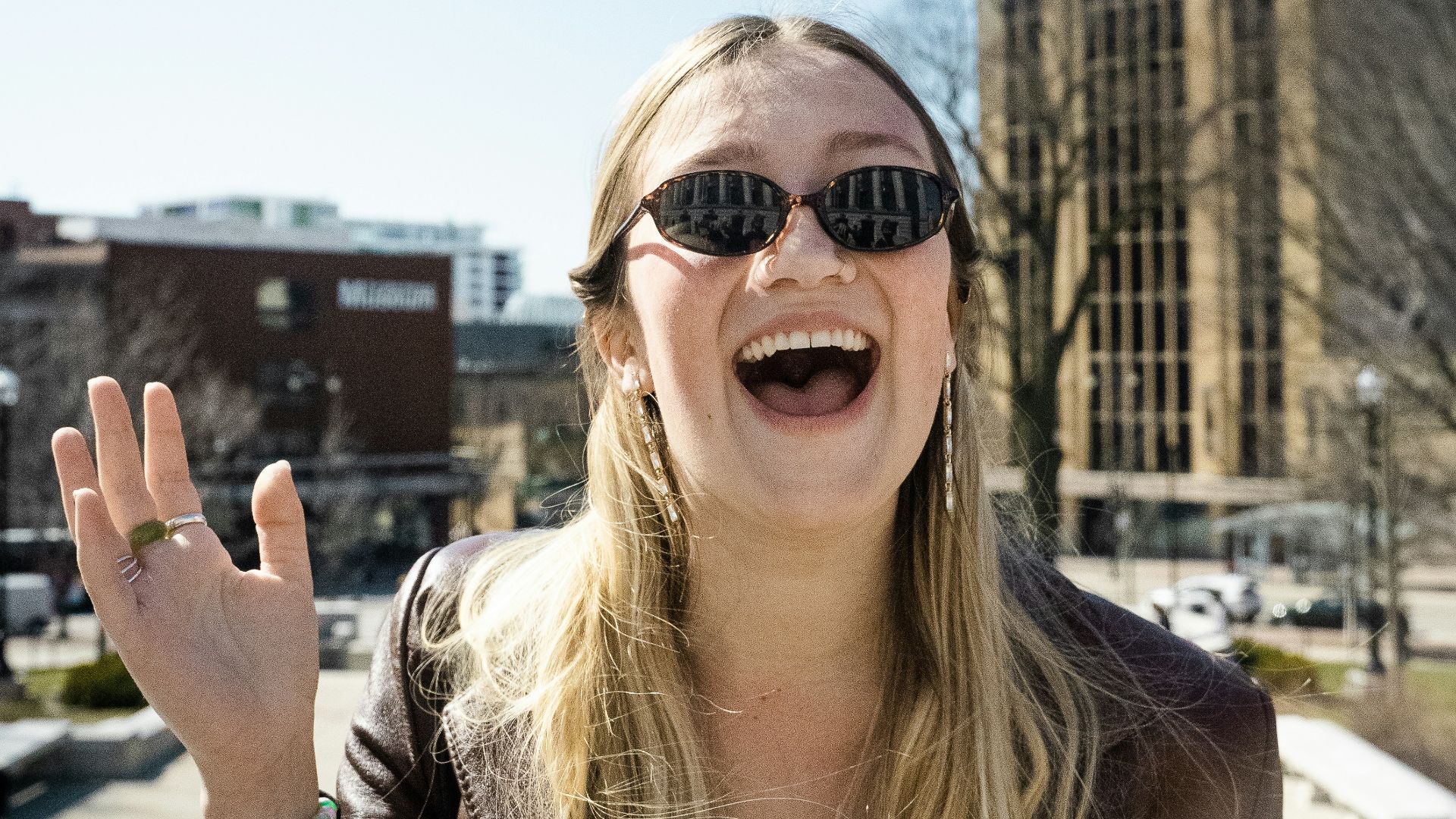 woman in brown sunglasses and brown shirt