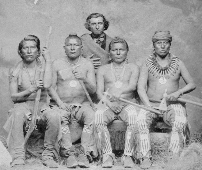 Studio portrait of four seated Pawnee chiefs