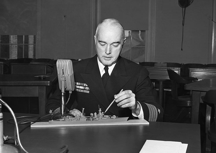 Officer Pointing at Ship Model