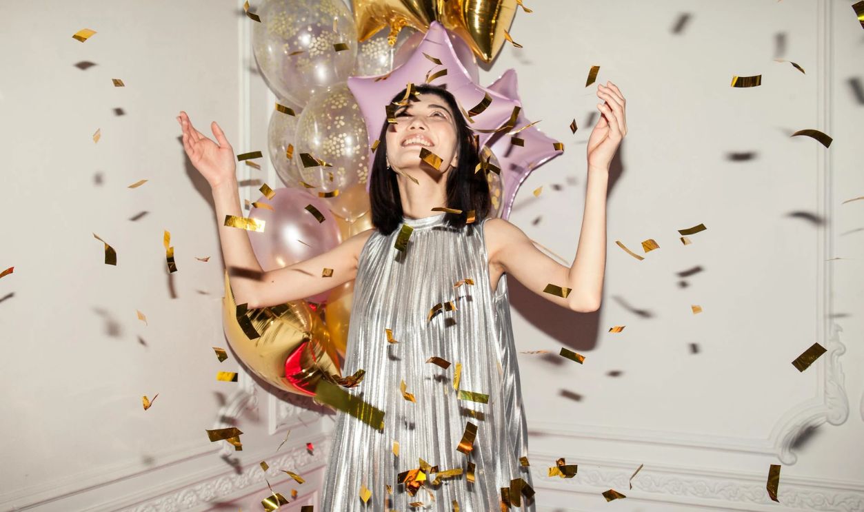 Woman Looking at Falling Confetti