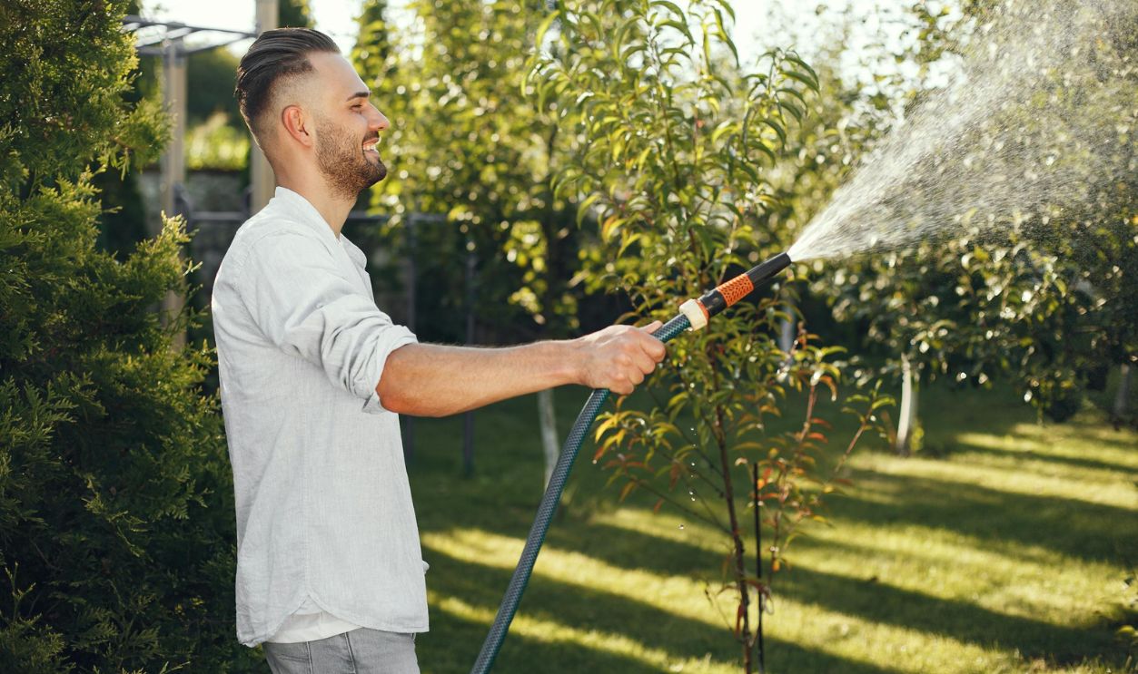 Man Watering Plants