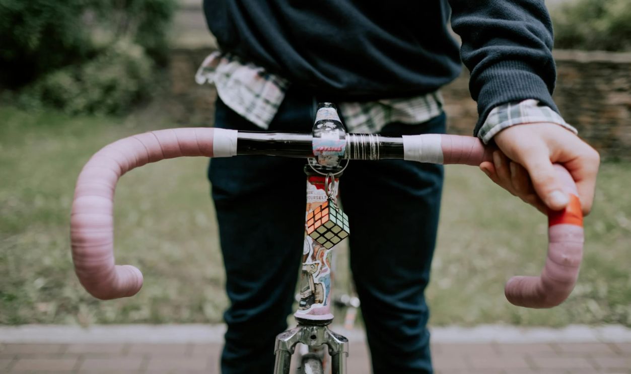 Road Bike Pink Handlebar Decorated with a Keychain
