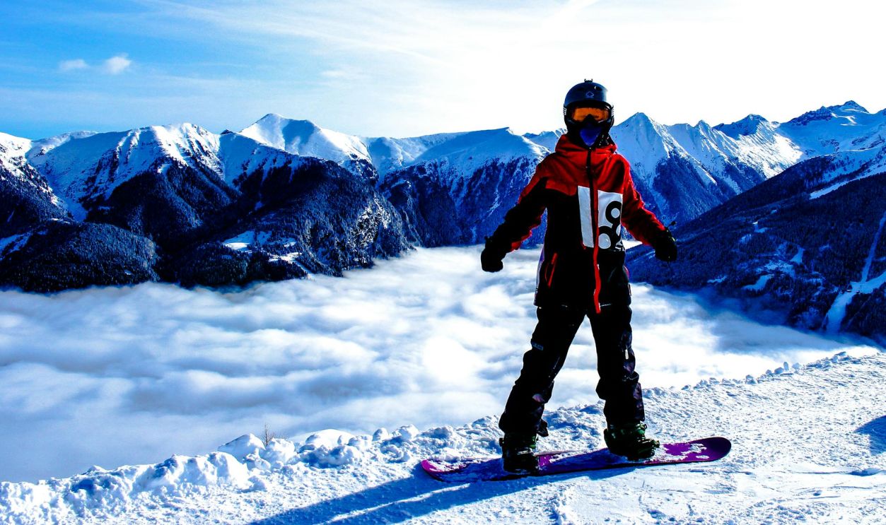 Snowboarded on Snow Covered Mountain
