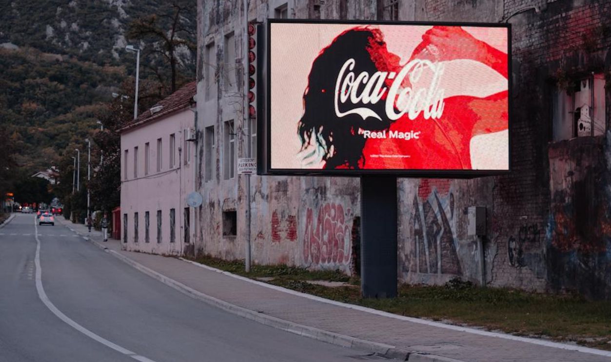 Coca-Cola Billboard by Roadside in City