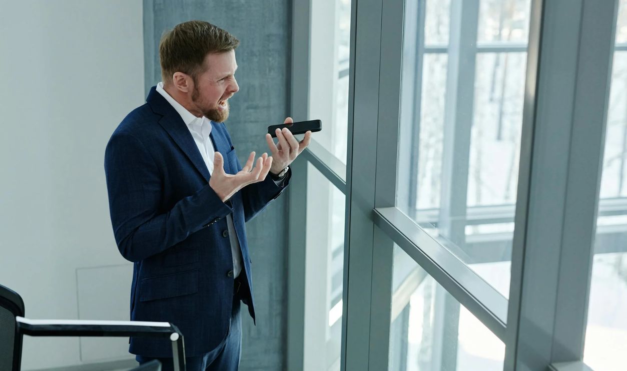 Man Holding Black Smartphone