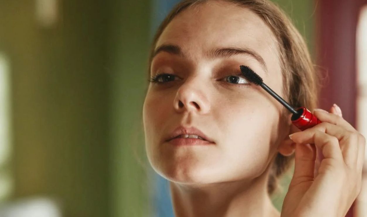 Woman applying Mascara