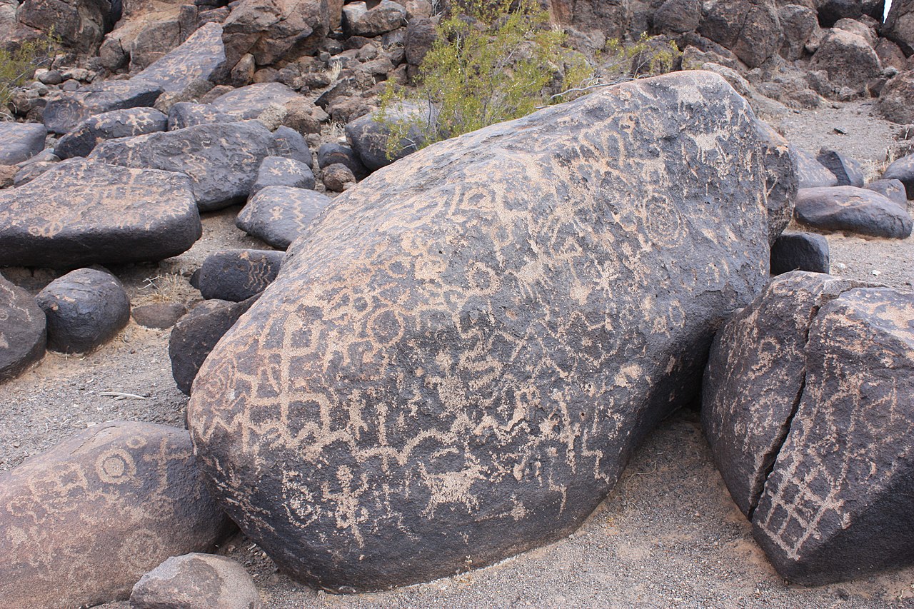 Prehistoric petroglyphs and modern inscription