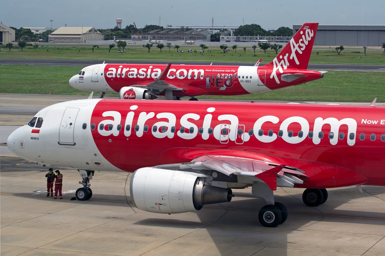 Commercial AirAsia Airplanes on the Runway