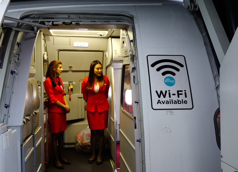 Wi-Fi sign on airplane door of AirAsia Airbus A320 docking at Singapore Changi Airport