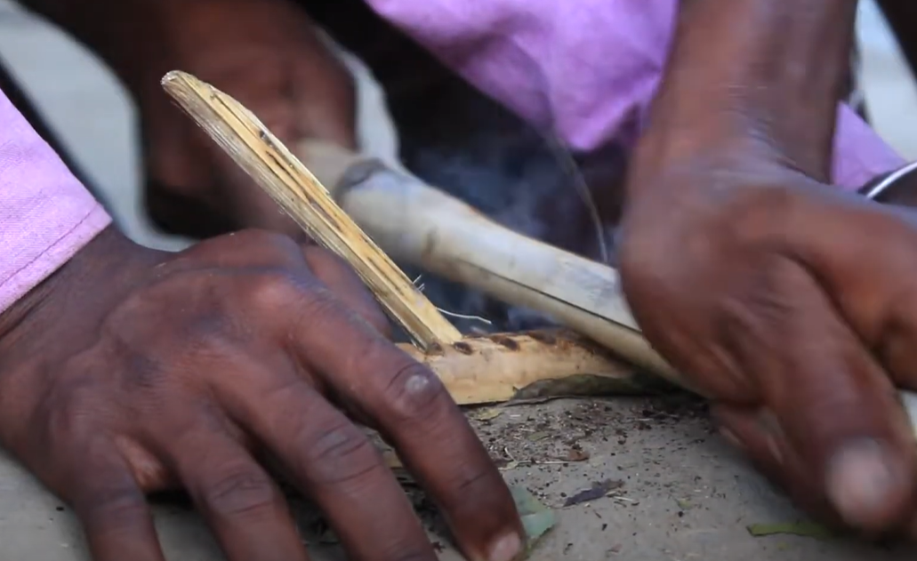 Baiga tribe people making fire