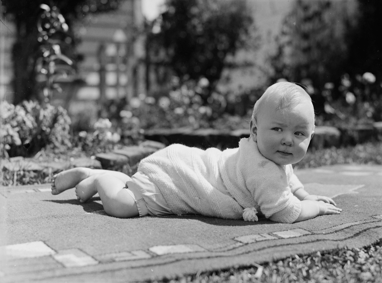 Portrait Of A Baby On A Rug Outside