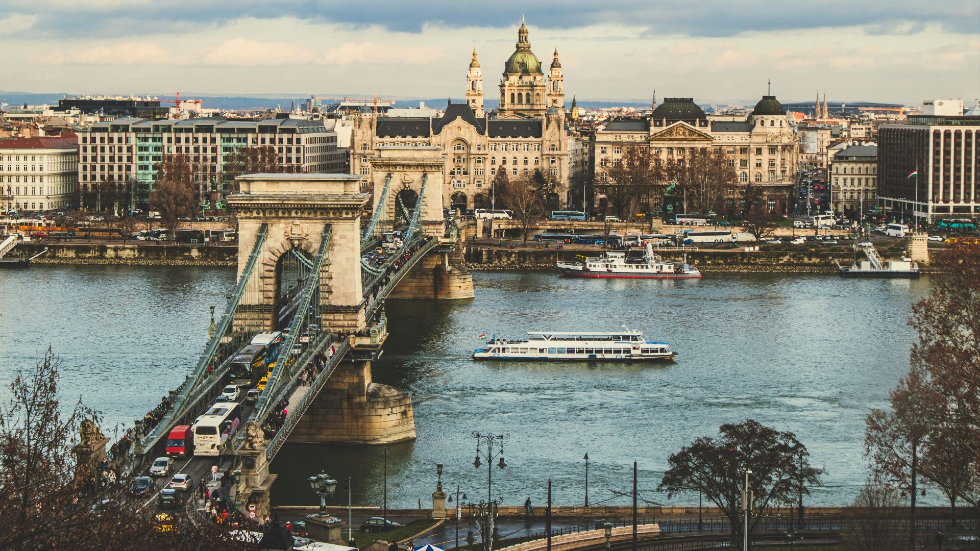 bridge over body of water in front of buildings