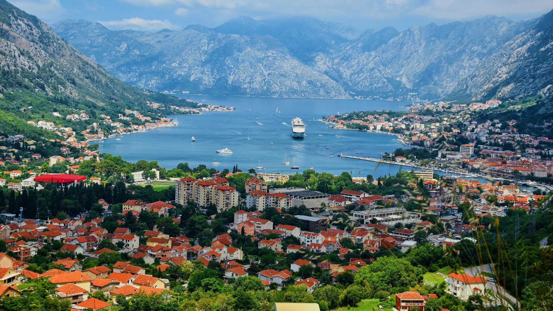 aerial view of city near body of water during daytime