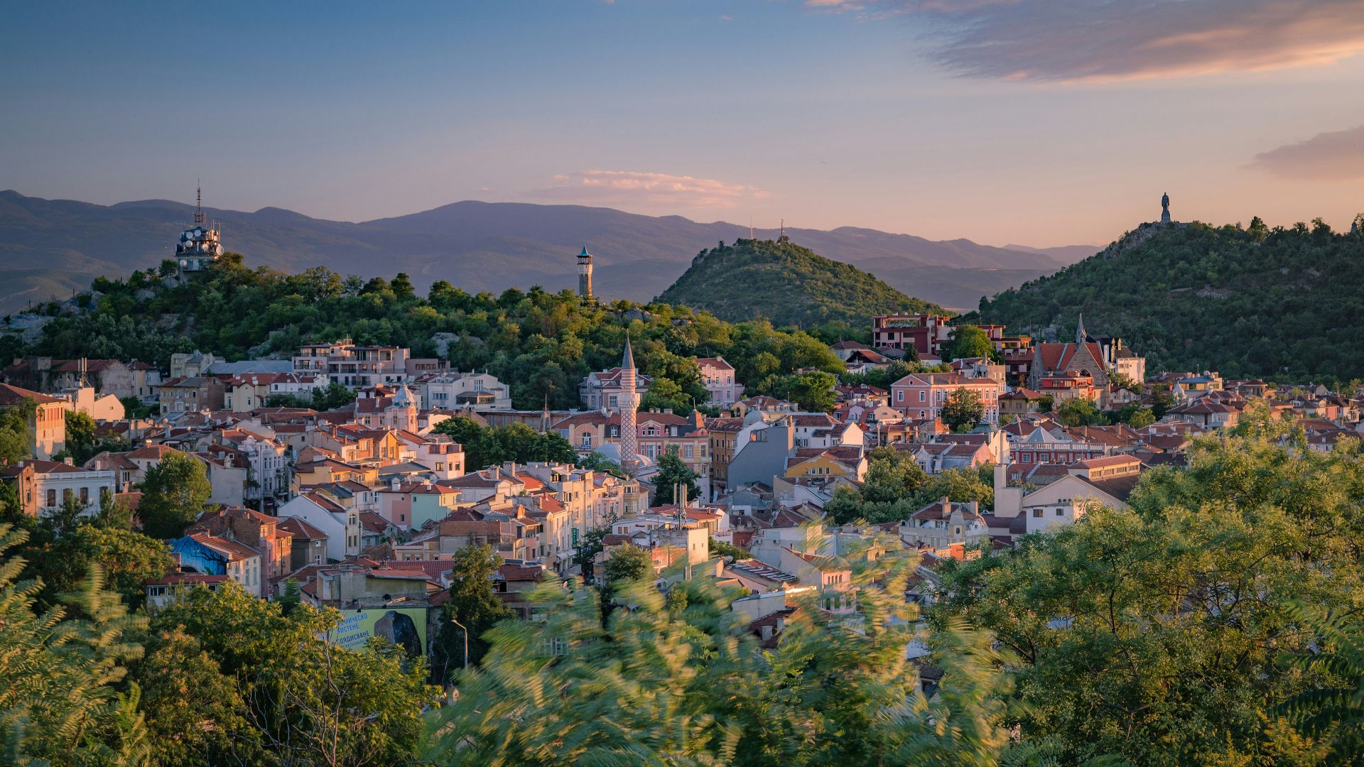 a small town surrounded by trees and mountains